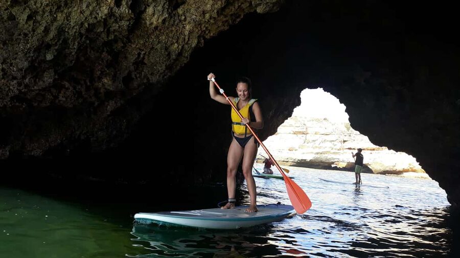 Albufeira: Caves and cliffs Paddleboarding (SUP) Tour - Finding the kiosk at Praia da Coelha