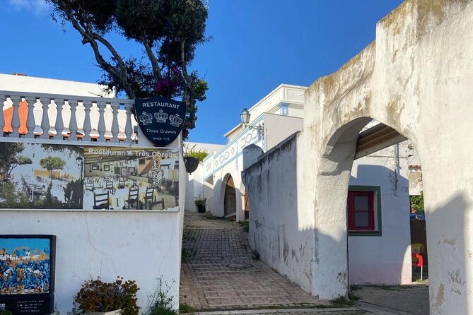 Albufeira History Walking Tour with Wine and Tapas - Portuguese cheese, fish cake, and a glass of wine