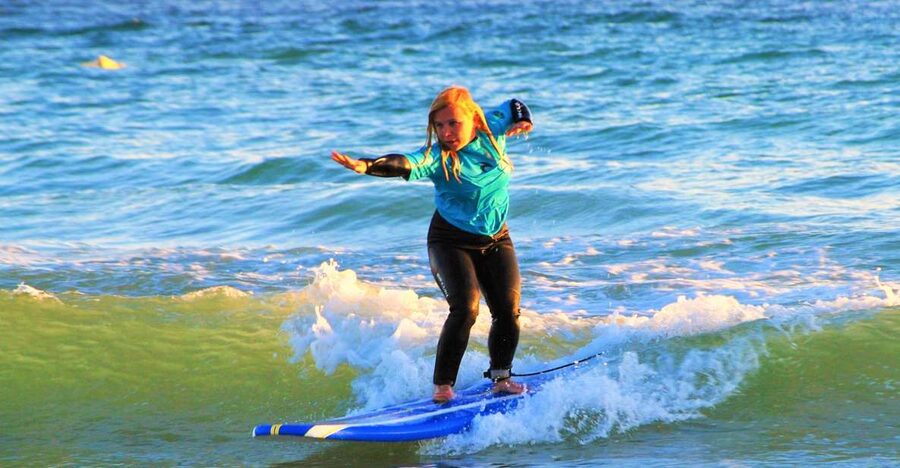 Albufeira: Surfing Lesson at Galé Beach - Getting fitted with the board and wetsuit