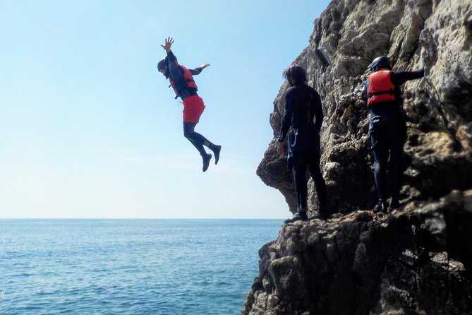 Coasteering and Cliff Jumping Near Lagos - Swimming through caves and along the rocks