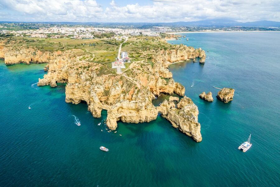 From Lagos: Algarve Golden Coast Cruise - Praia da Luz and the black rock at the shore
