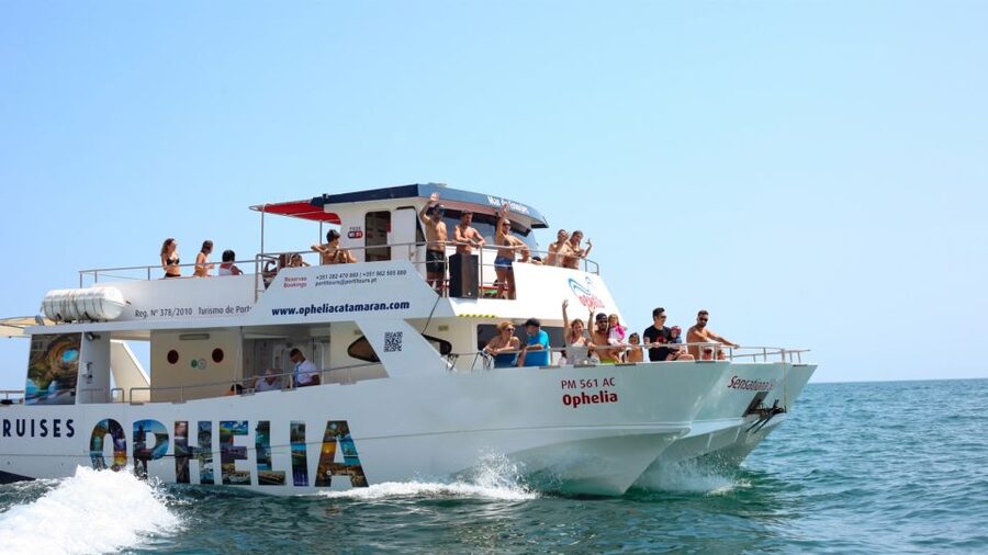 From Portimão: Catamaran Cruise to Benagil Caves with BBQ - Cruising past Ferragudo Castle