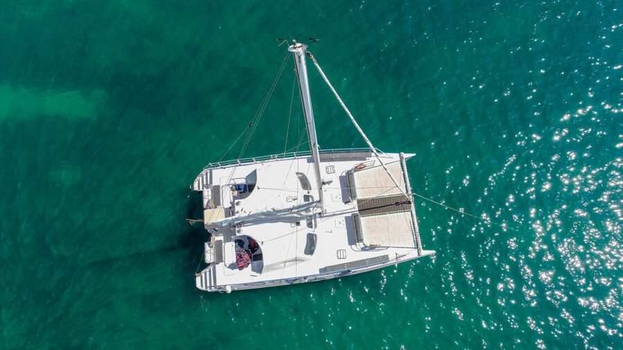 From Vilamoura: Sunset Catamaran Experience - Coastal rock formations, caves, and local stories