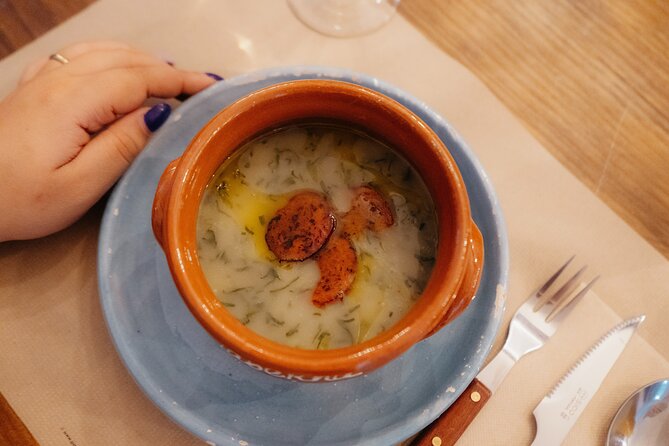 Heart of Lisbon Food Tour: Baixa, Chiado & Bairro Alto - Chiado brings bifana, soup, beer, and an unusual setting