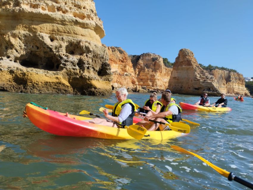 Lagoa: Benagil Cave and Marinha Beach Guided Kayaking Tour - Passing Marinha Beach and its natural arches