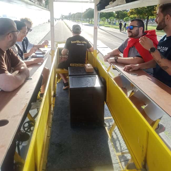 Lisbon: 1-Hour Beer or Sangria Bike Sightseeing Tour - A moving party beside the Tejo