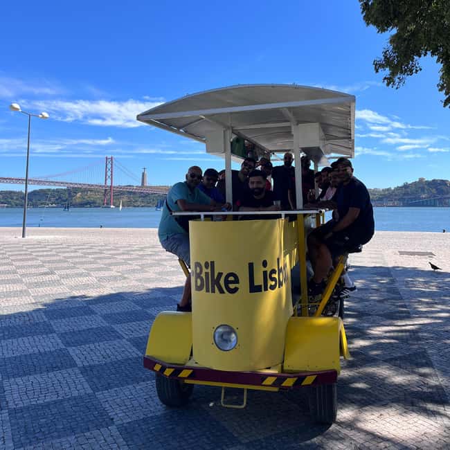 Lisbon: 1-Hour Beer or Sangria Bike Sightseeing Tour - Music, lights, and group atmosphere