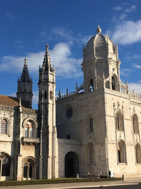 Lisbon: Belem Walking Tour with Jeronimos Monastery Ticket - The riverfront walk and the Monument to the Discoveries
