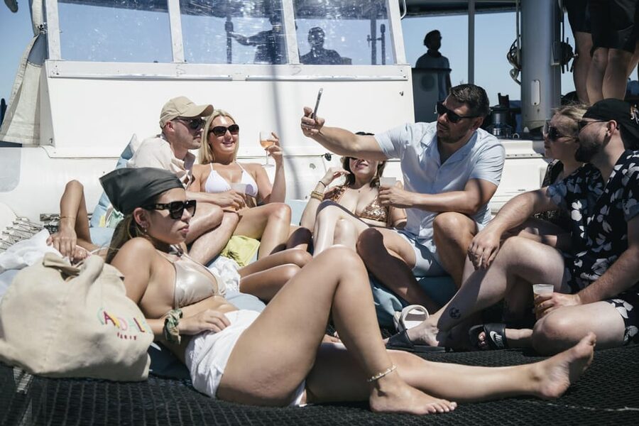 Lisbon: Catamaran Boat Party with Music, Open Bar & Dives - Music, dancing, and the one-hour open bar