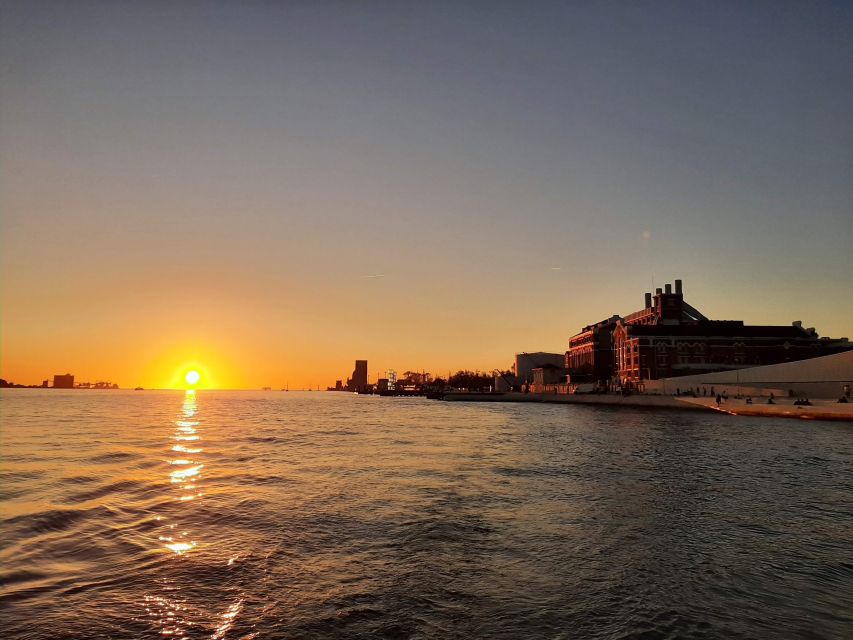 Lisbon: City Skyline Sailboat Cruise with Drink and Snacks - Santo Amaro Dock and the first minutes aboard