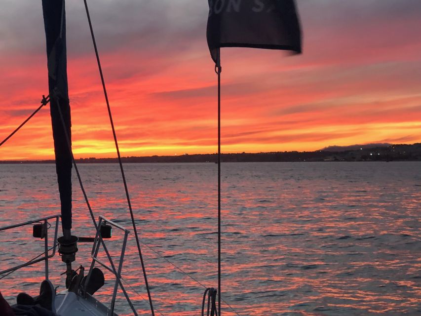 Lisbon: Enjoy a Sunset or Night Tagus River Sailboat Cruise - Starting in Belém with a drink in hand