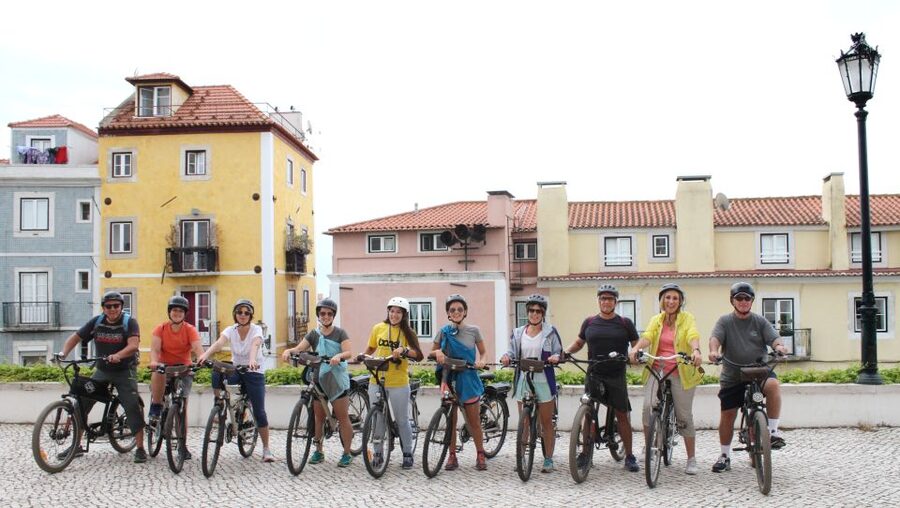 Lisbon: Hills, Alfama, and Mouraria Tour by Electric Bike - Riding through Alfama