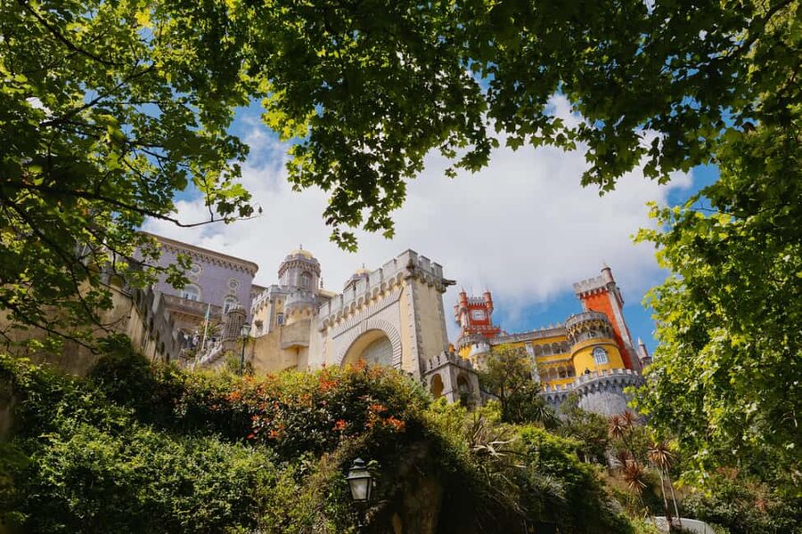 Lisbon: MiniBus Sintra, Pena, Regaleira, Cap Roca Tour - Pena Palace and its theatrical hilltop setting