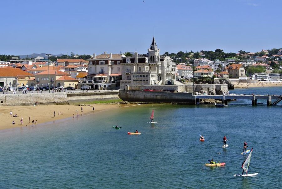 Lisbon: Sintra, Azenhas do Mar and Cascais Day Trip - Praia Grande, surfers, and dinosaur footprints