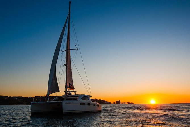 Lisbon: Sunset Cruise With Drinks on Spacious Yacht - Boarding below the 25 de Abril Bridge