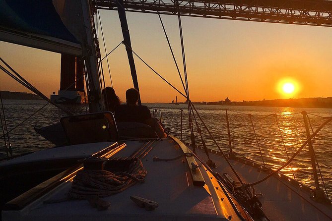 Lisbon Sunset Sailing Tour with White or Rosé Wine and Snacks - Looking up at Cristo Rei from the water