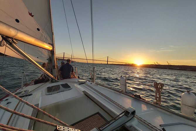 Lisbon: Sunset Sailing with Portuguese Wine and History - Returning beneath the 25 de Abril Bridge