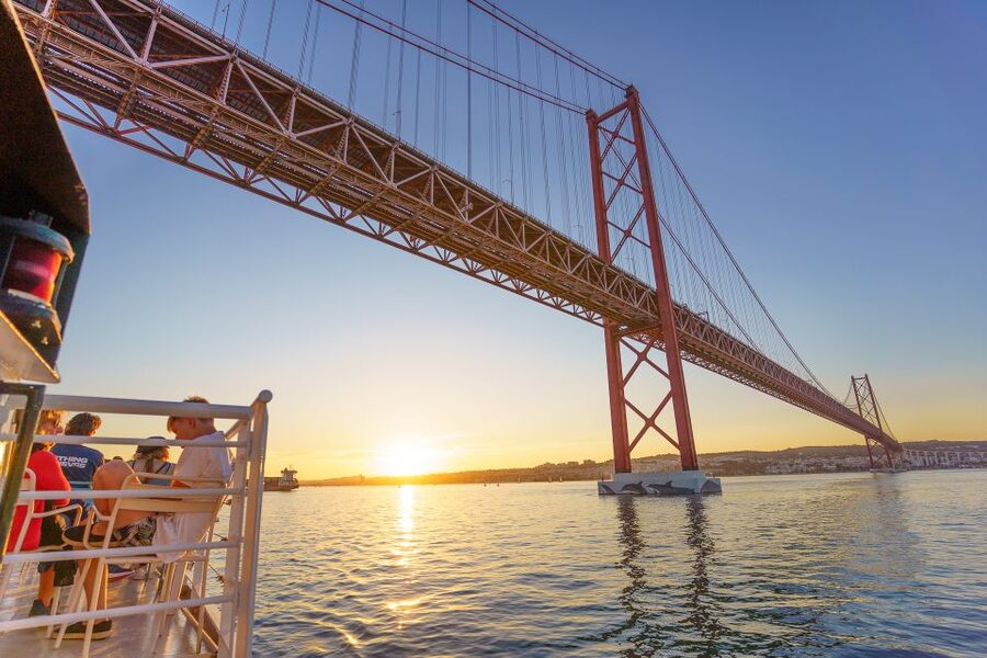 Lisbon: Tagus River Sunset Tour with Snacks and Drink - Christ the King across the river