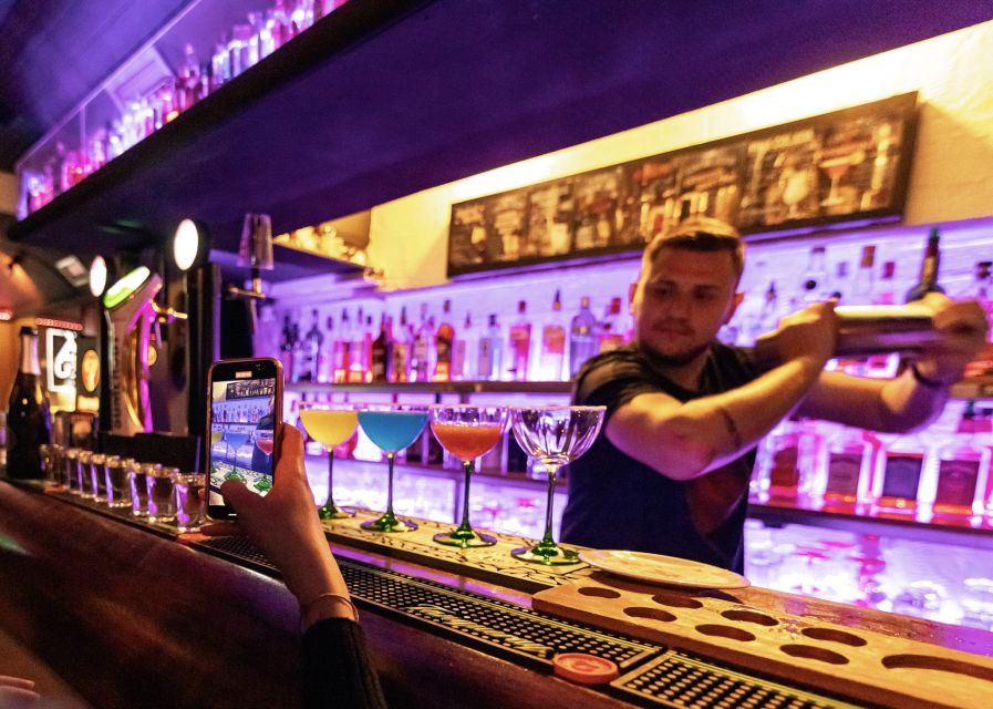 Lisbon: Tipsy Tour Fun Bar Crawl with a Local Guide - Walking into Bairro Alto after dark