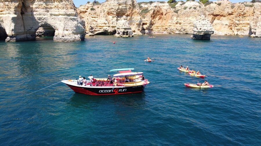 Portimão: Benagil Caves Speedboat and Kayak Guided Tour - Entering Benagil Cave by kayak