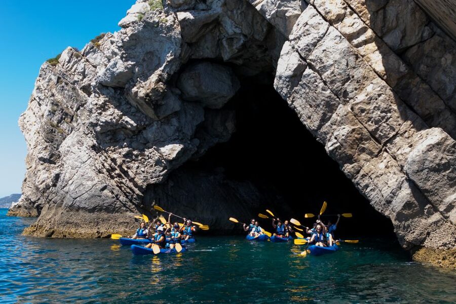 Sesimbra: Arrabida Natural Park & Caves Guided Kayaking Tour - Starting beside the blue kayaks in Sesimbra